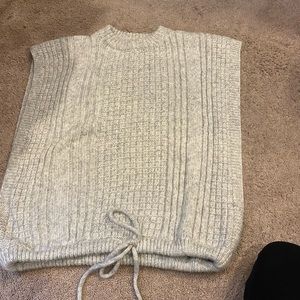 Worn once sweater vest like large openings for arms